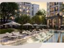 Luxurious apartment complex with outdoor pool and lounge chairs