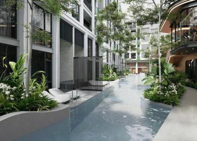 Modern residential building with an indoor pool and surrounded by greenery