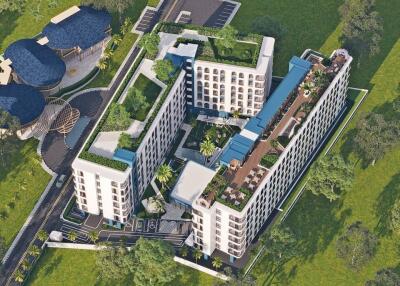 Aerial view of a modern residential complex with green rooftops