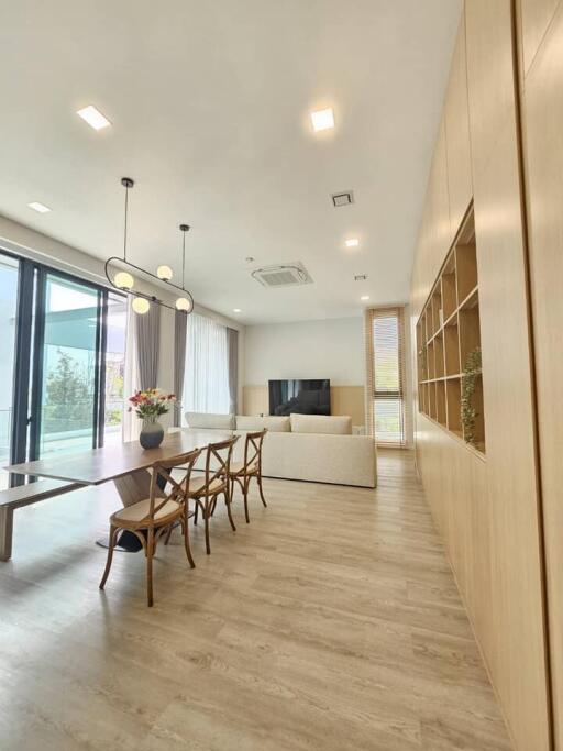 Modern living room with dining area and large windows