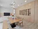 Modern living room with dining area and built-in shelving