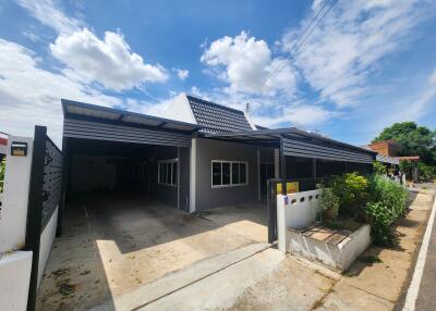 Image of the exterior of a house with a carport
