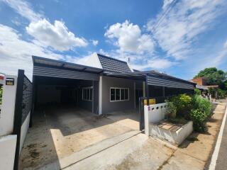 Image of the exterior of a house with a carport