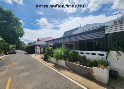 View of the house exterior and surrounding street