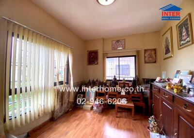 Cozy living area with wood flooring and ample natural light