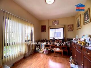 Cozy living area with wood flooring and ample natural light