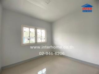 Empty bedroom with tiled floor and window