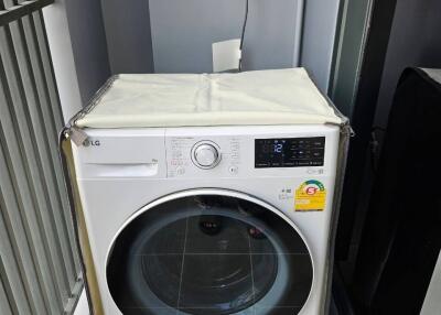 Laundry area with LG washing machine