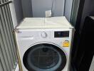 Laundry area with LG washing machine