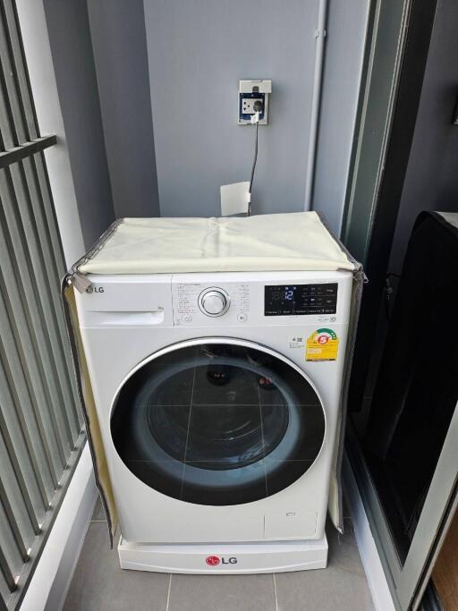 Laundry area with LG washing machine