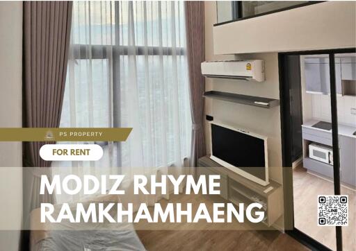 Modern living room with large window and high ceiling at Modiz Rhyme Ramkhamhaeng