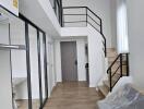 Modern duplex living room with wooden flooring and loft space