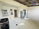 Modern kitchen with appliances and white tiled floors