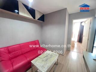 Modern living area with red sofa and marble coffee table