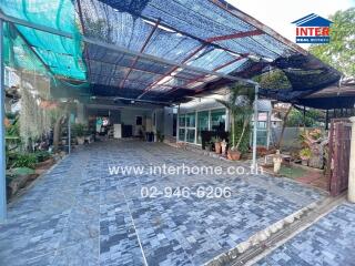 Spacious covered outdoor area with tiled flooring