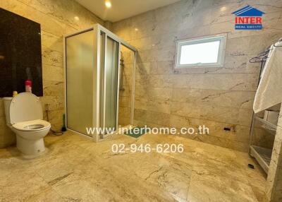 Spacious bathroom with shower and toilet