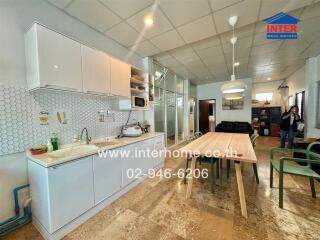 Well-lit modern kitchen with dining area