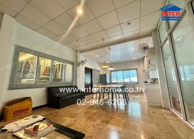 Open living room with view into kitchen and dining area