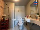 Bathroom with shower, toilet, and sink