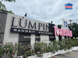 Building exterior with Lumphini Township sign