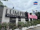 Building exterior with Lumphini Township sign