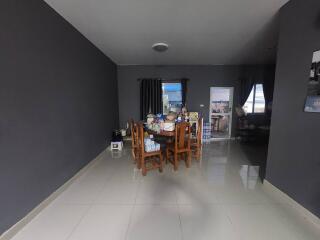 Dining room with dark walls and wooden dining set