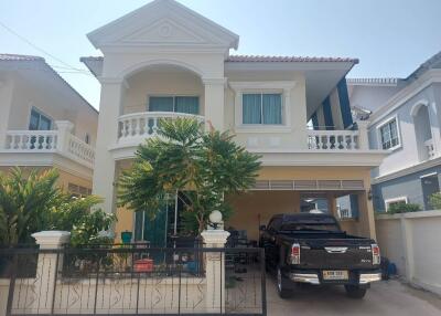 Two-story house with balcony and garage