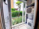 Laundry area with washing machine and air conditioning units