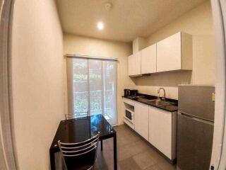 Modern kitchen with dining area and appliances