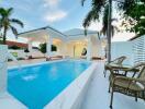 Outdoor pool area with patio and seating