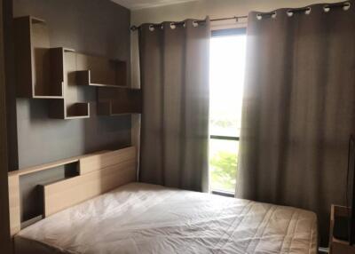 Bedroom with modern shelving and curtains