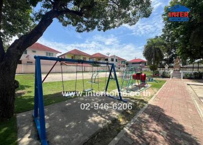 Playground with swings and climbing equipment in a residential area