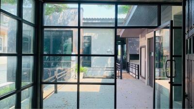 View of building exterior through glass doors