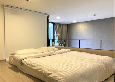 Spacious bedroom with a double bed and modern decor