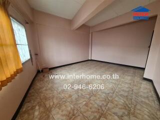 Empty living room with tiled floor