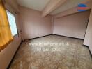 Empty living room with tiled floor