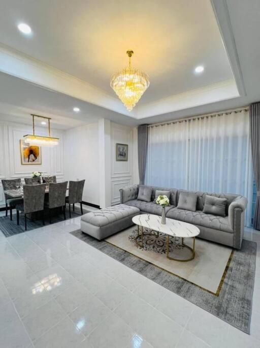 Spacious living room with adjoining dining area