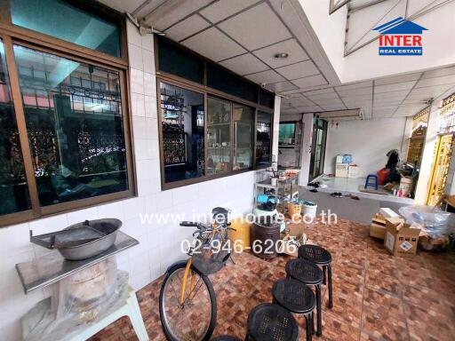 Indoor kitchen with various cooking appliances and utensils