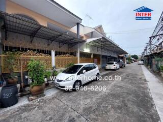 Front view of a residential property with parking space