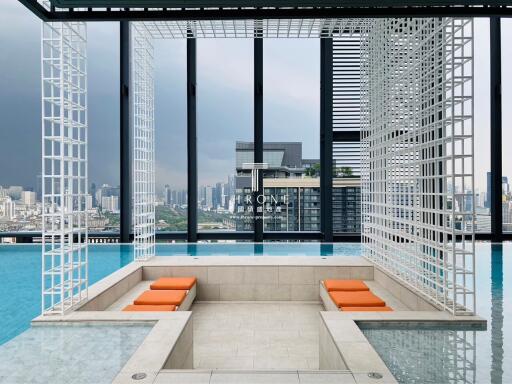 Modern rooftop pool area with city view