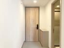 Entryway with wooden door and modern decor