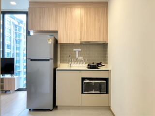 Compact modern kitchen with stainless steel appliances