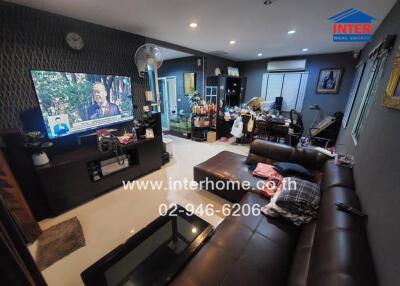 Spacious living room with furniture and television
