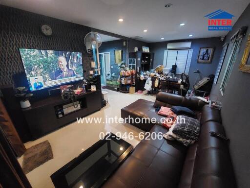 Spacious living room with furniture and television