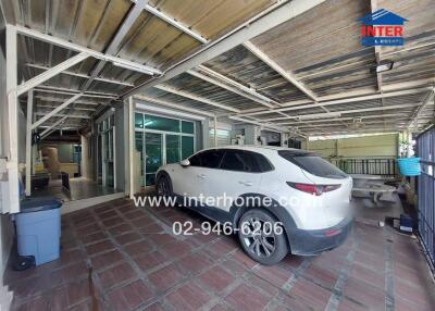 Spacious garage with parked white car