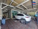 Spacious garage with parked white car