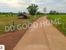 Country road with a house and green fields