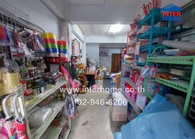 Small store interior with various products on shelves