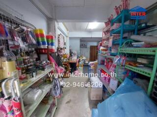 Small store interior with various products on shelves