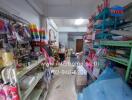 Small store interior with various products on shelves